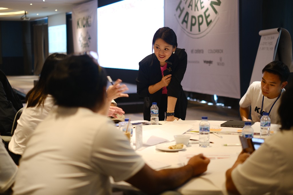 Yulia Saksen facilitating a brand workshop with a leadership team